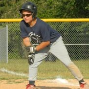 Boy leaning off base